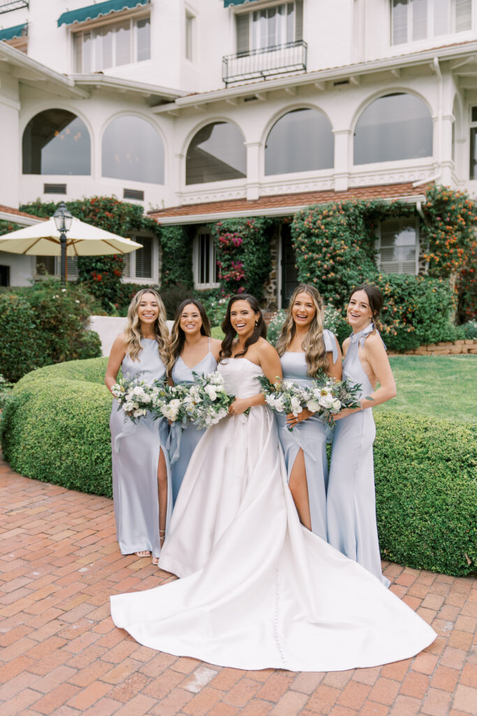 bridal party laughing outdoors