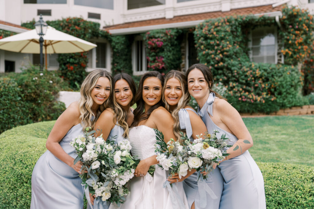 bride and bridesmaid posing for a portrait