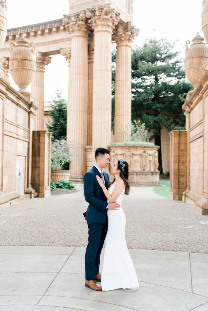 white dress and suit at palace of fine arts engagement session