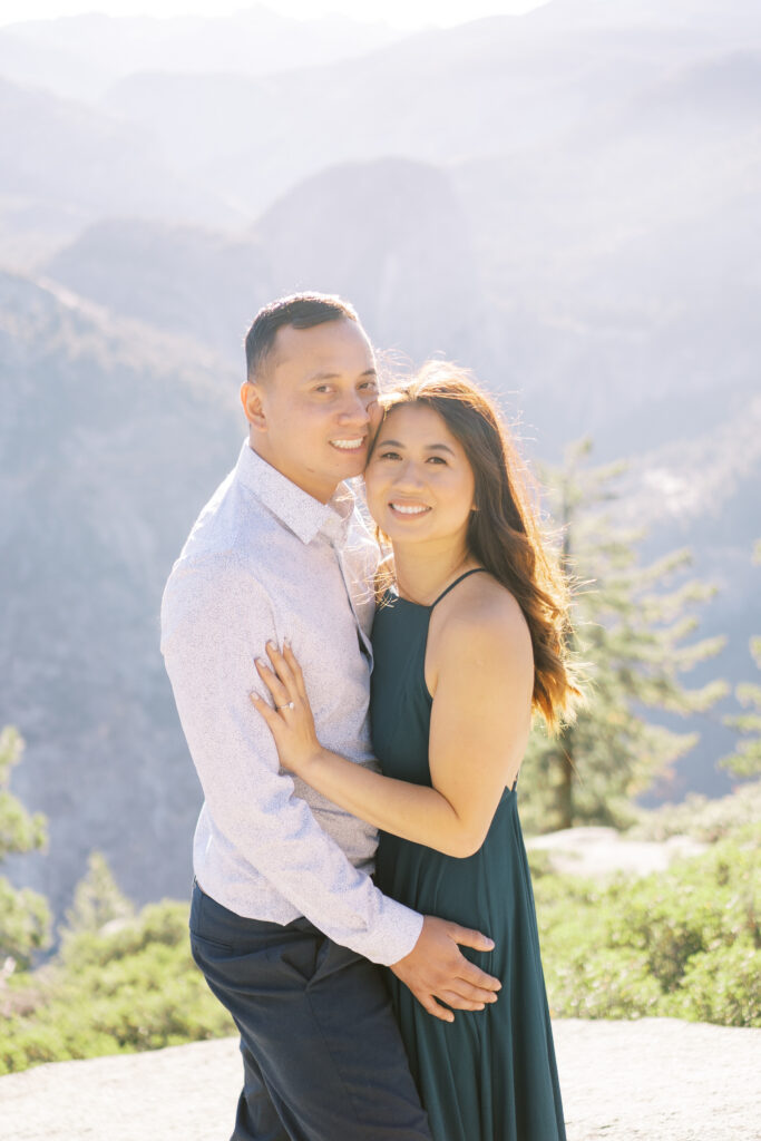 Couple smiling outdoors in warm sunlight
