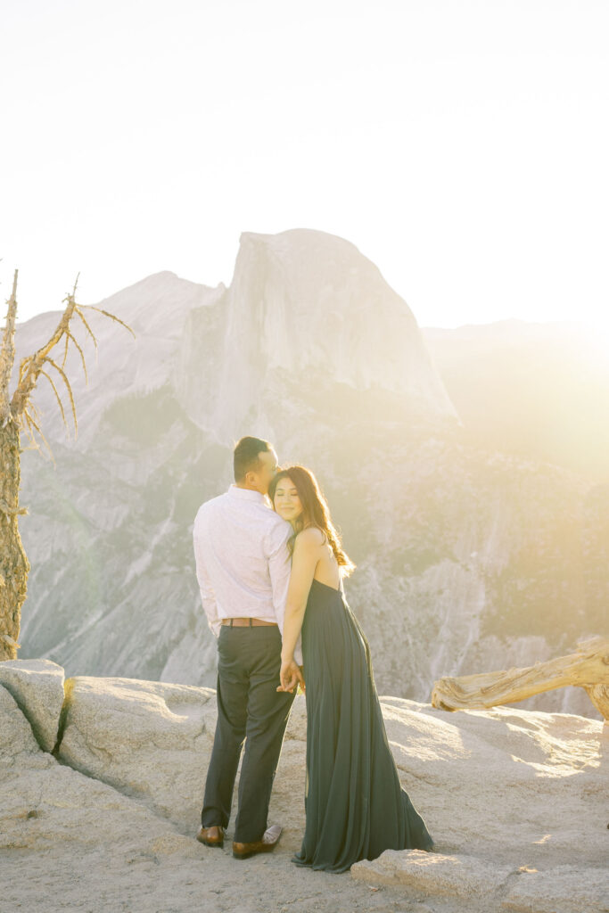 Newly engaged couple intimate moment at the cliffside