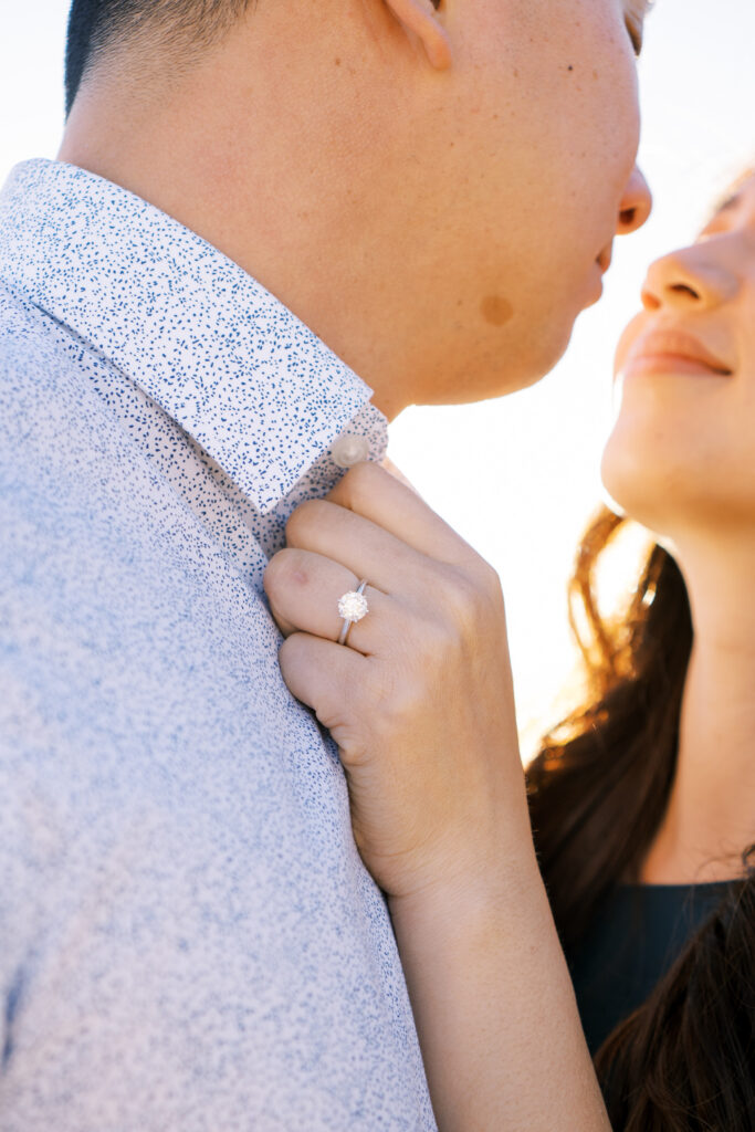 newly engaged couple close up photo of the ring