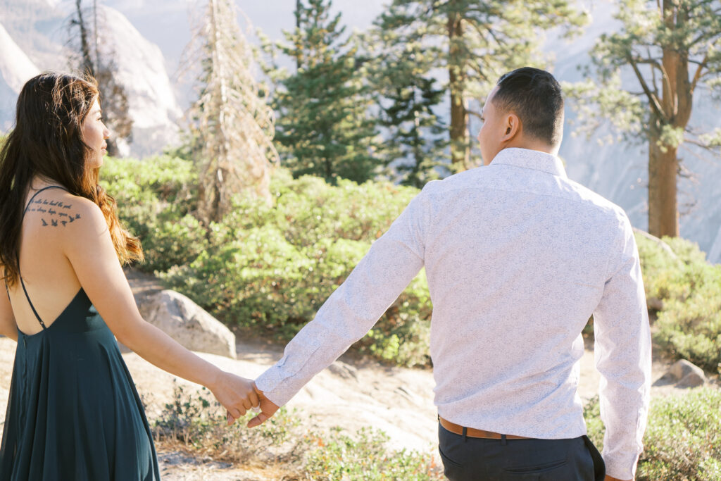 couple holding hands walking