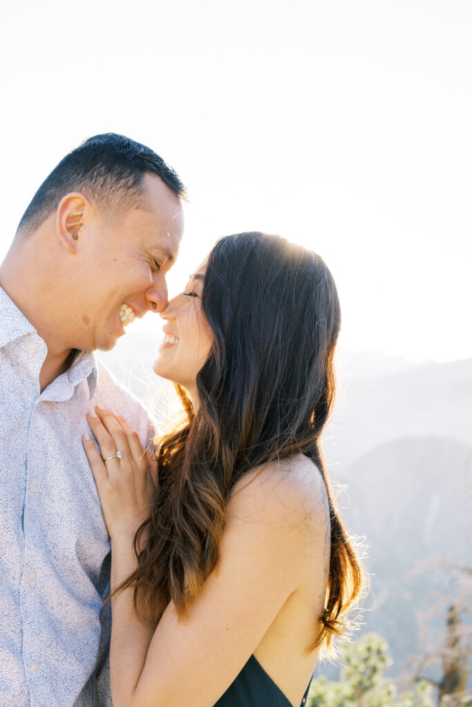 nose-to-nose photo of couple newly engaged