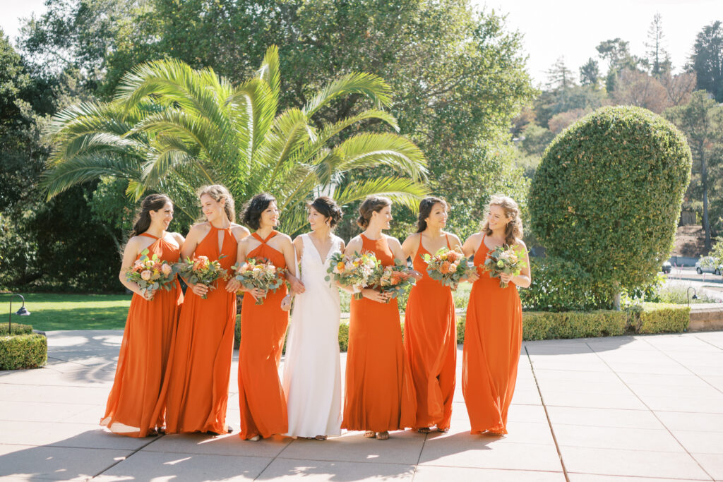 Bride and bridesmaid sharing a candid laugh