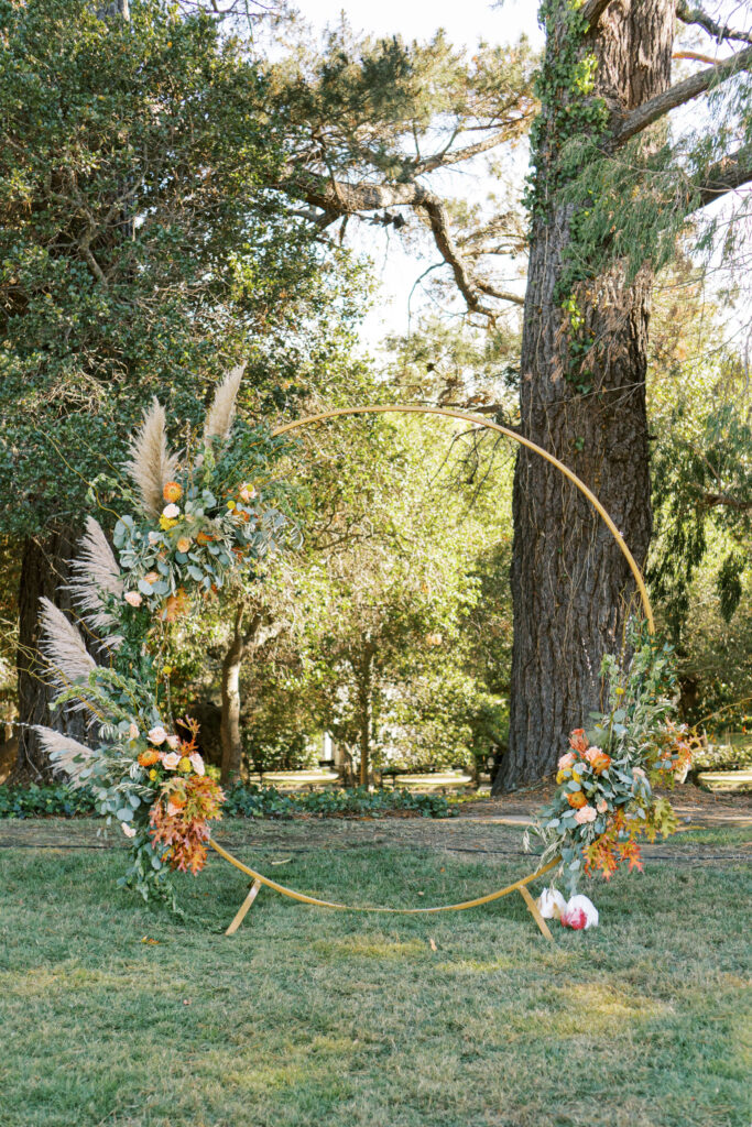 Beautiful wedding arch decorated with flowers and greenery