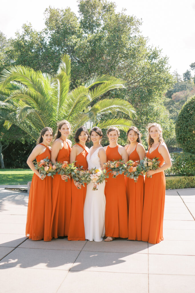 Bride and bridesmaid sharing a joyful moment