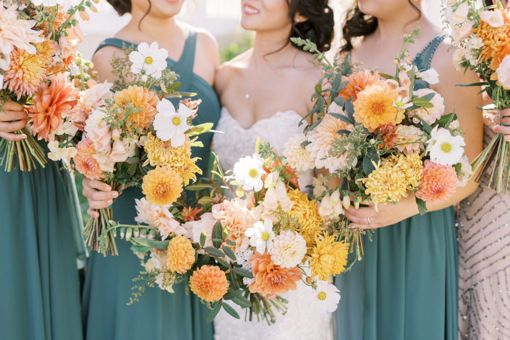 bride and bridesmaids with fall bouquets