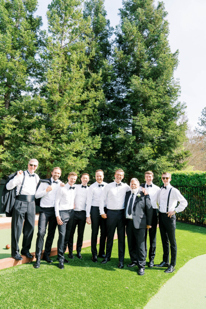 groomsmen with groom being funny