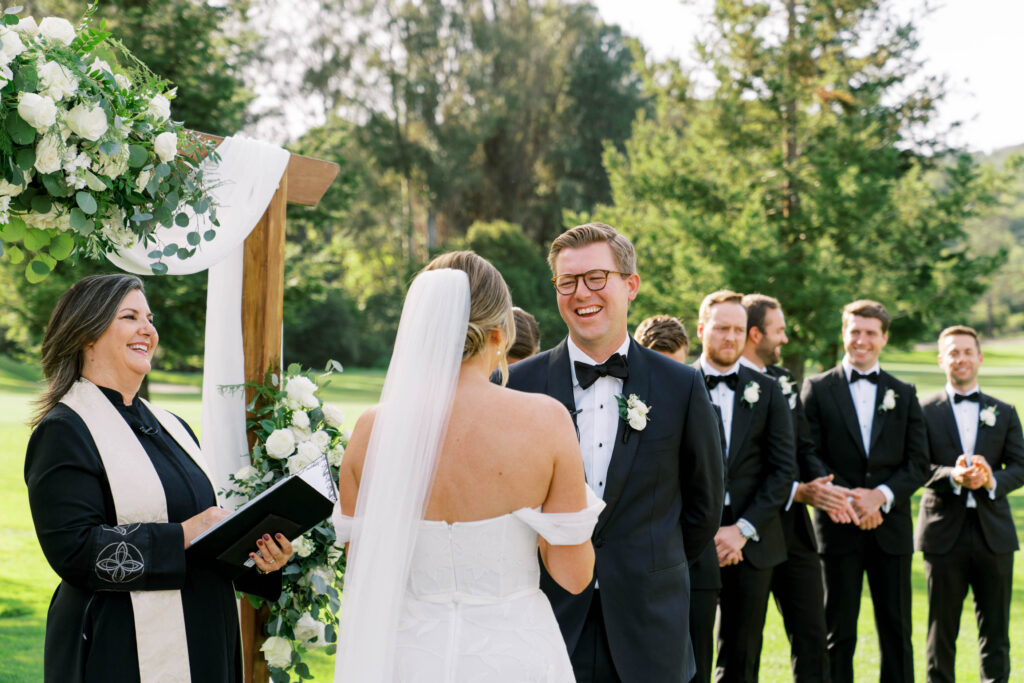 groom laughing during ceremony