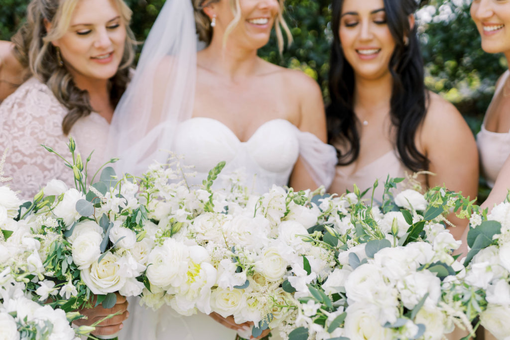 bride and bridesmaid holding bouquets