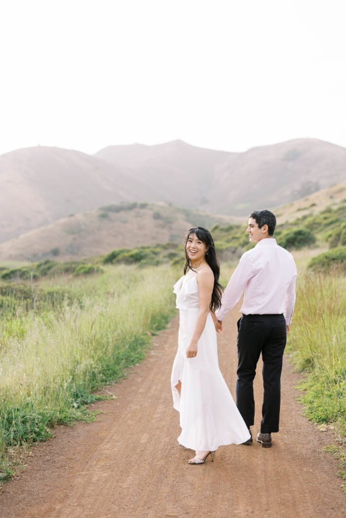 bride and groom walking outdoors in nature