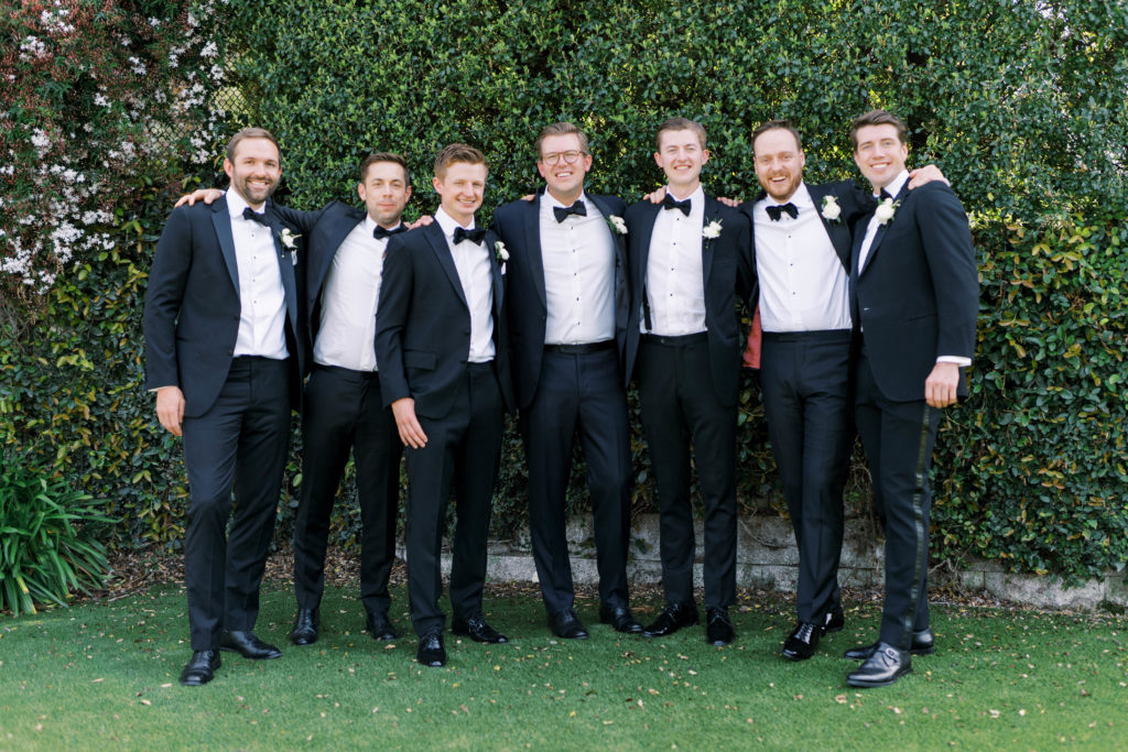 groomsmen with groom posed photo group
