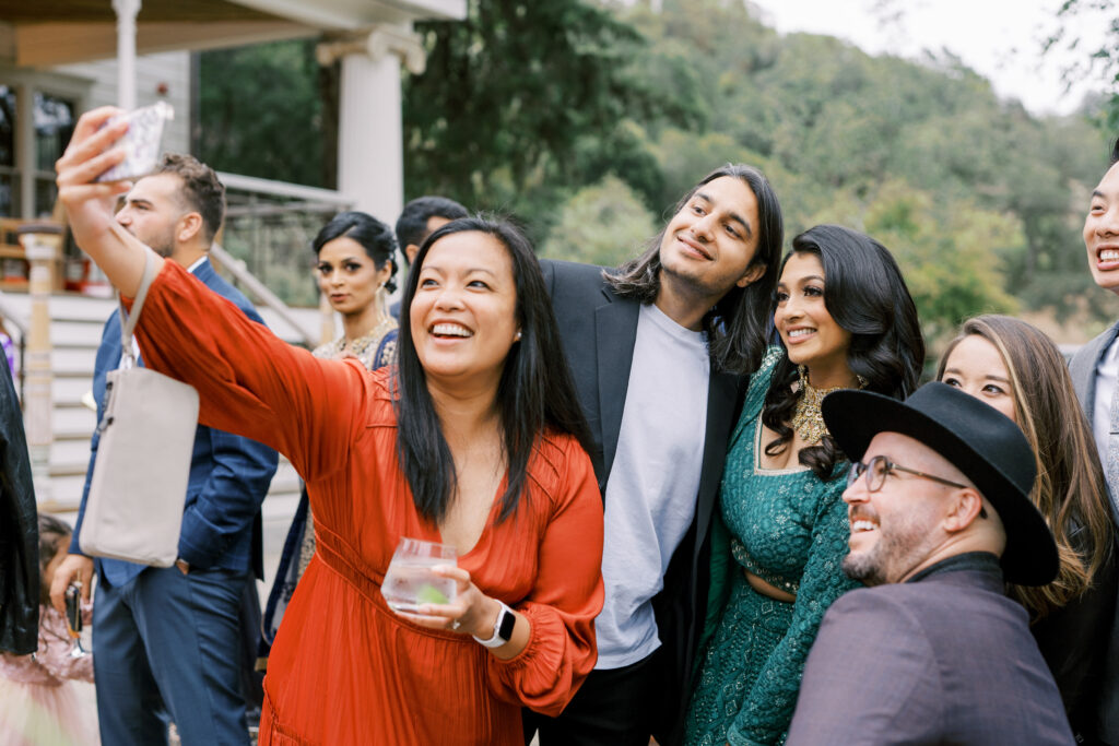 Guests taking a selfie with the bride