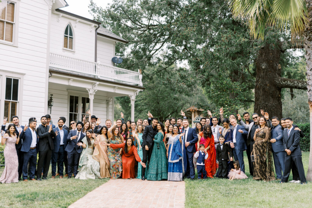 Goofy portrait of the bride and groom and their guests
