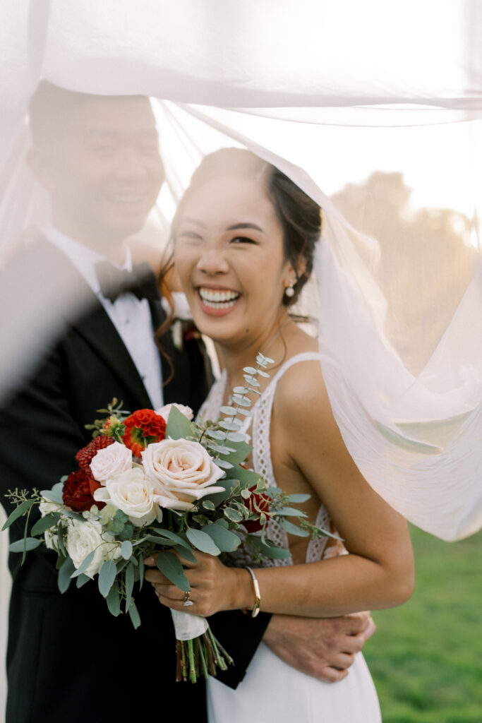 couple within the bride's veil