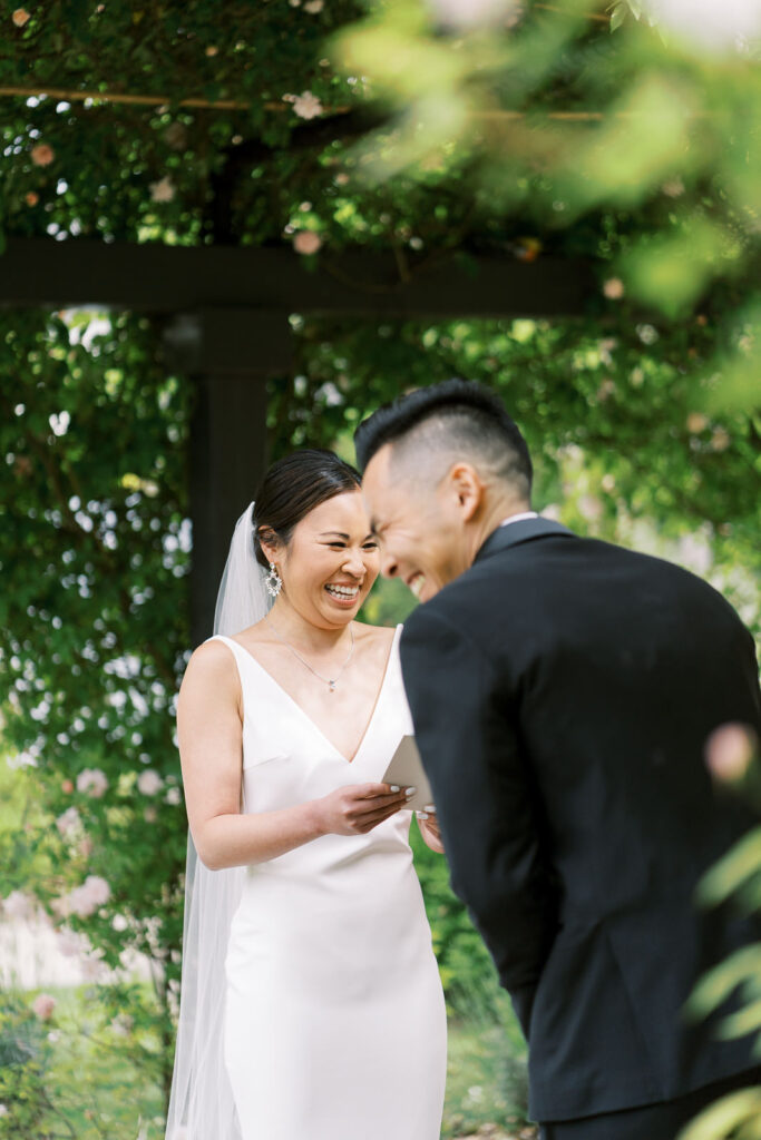 couple giggling mid vow