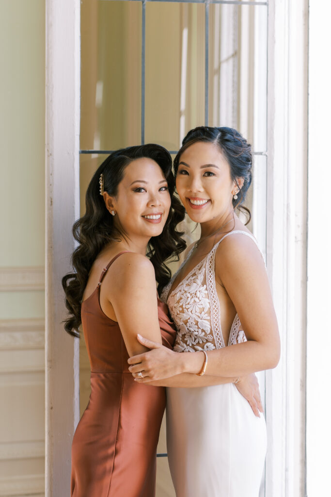 portrait of a bridesmaid and the bride together