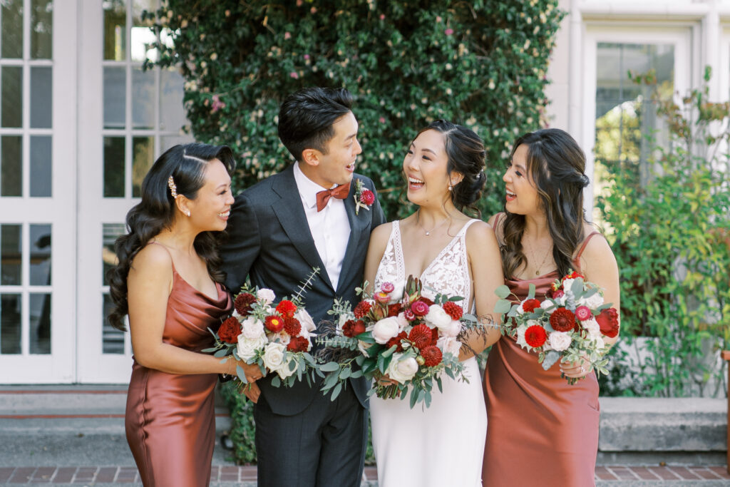 close bridal party smiling together