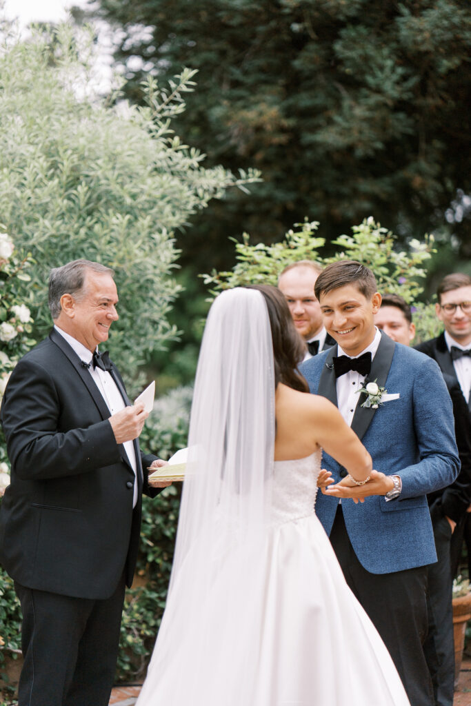 groom holding his bride's hands