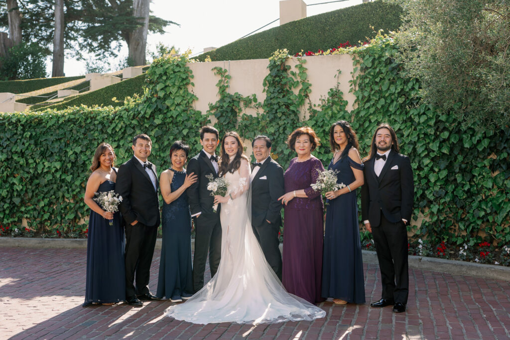 bride and groom with family