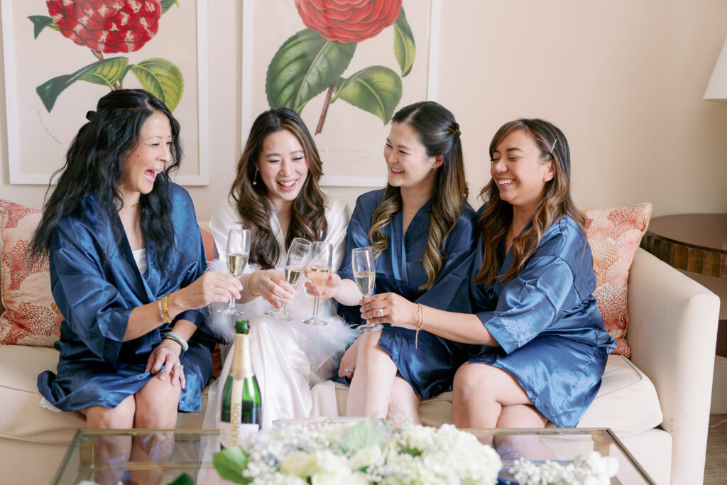 bridesmaids sharing champagne