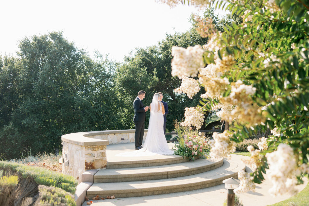 bride and groom exchaging vows