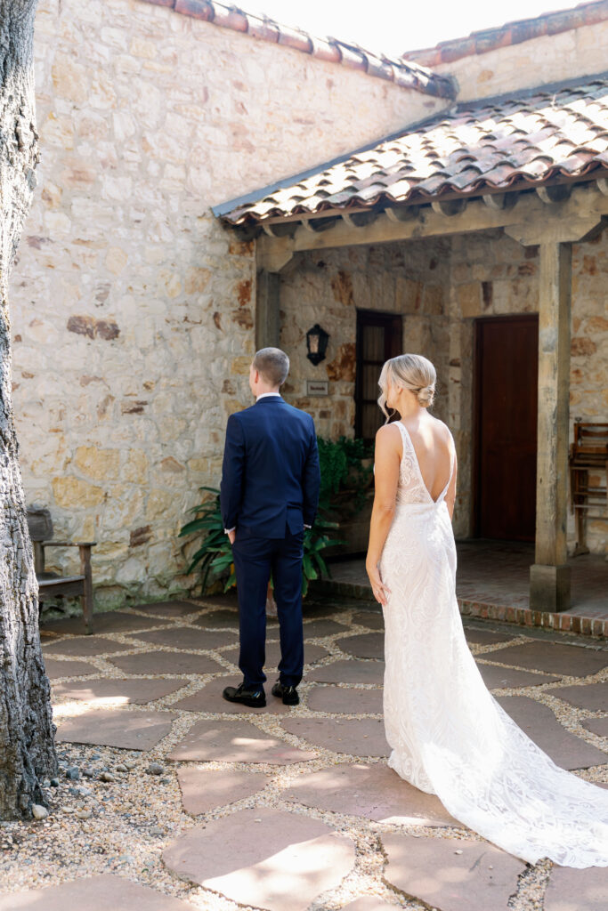 bride and groom preparing for first look