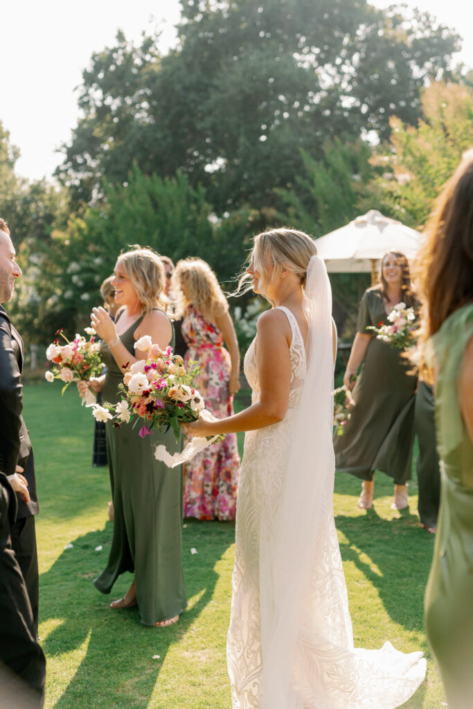 candid photo of bride talking to a guest