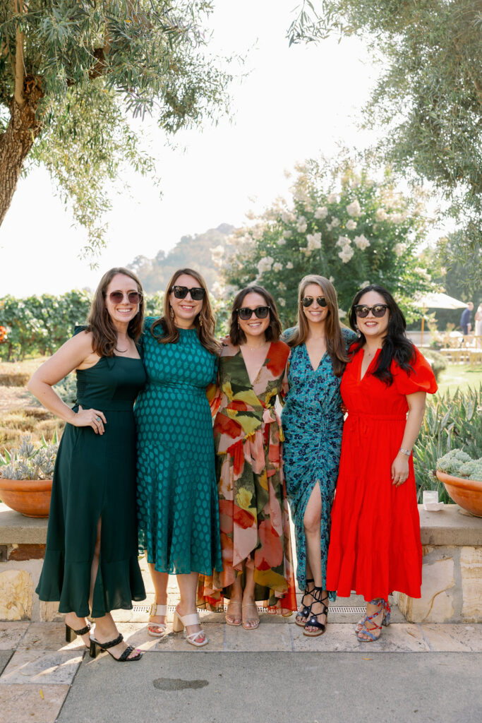 female wedding guests posing for a photo