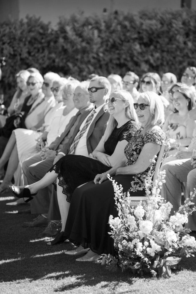 wedding guests laughing candidly