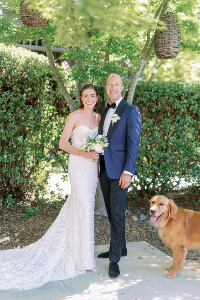 bride and groom and golden retreiver