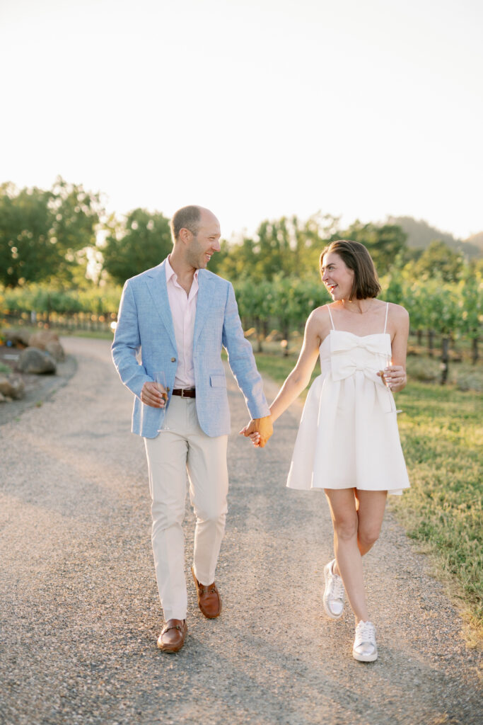 bride and groom walking hand in hand