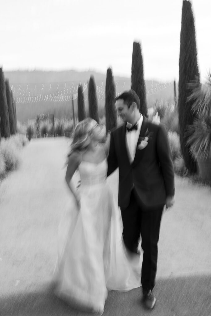 blurry photo of bride and groom looking at each other
