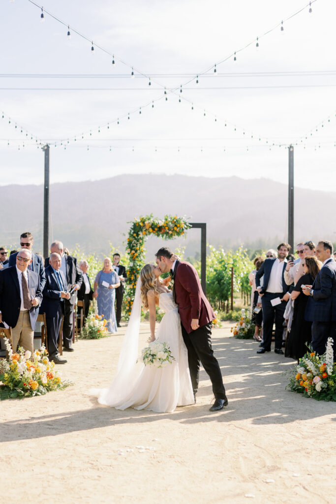 bride and groom first kiss