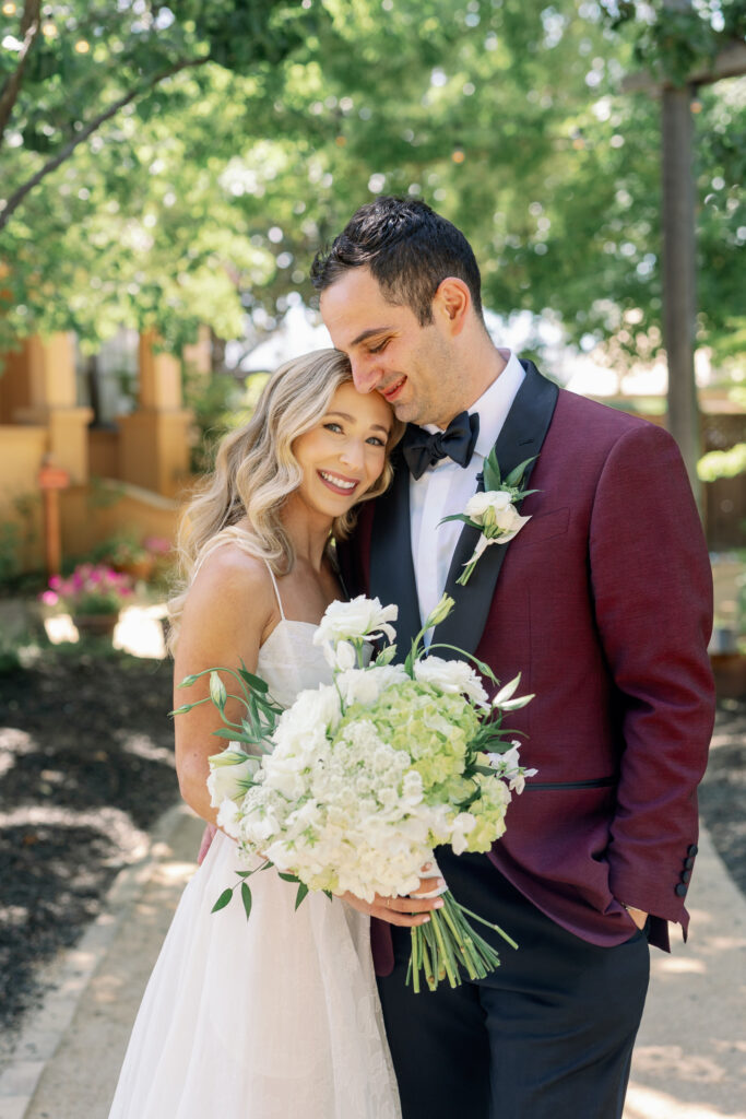 bride and groom posing for a picture