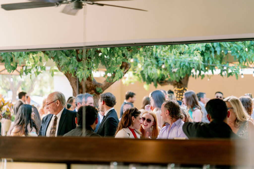 candid photo of guests at the reception talking to each other