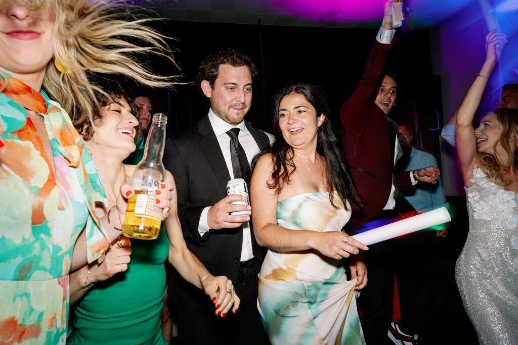 candid photo of guests having fun at the wedding party